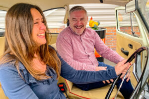 Visitors inside the VW Beetle in Beaulieu's new attraction We Had One of Those 